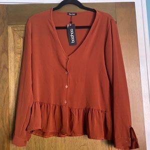 Rust colored button up peplum blouse